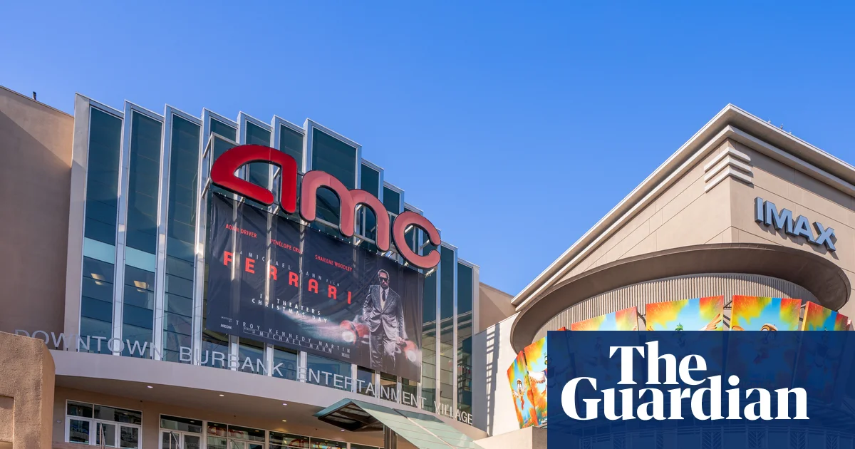 Moviegoer using phone during