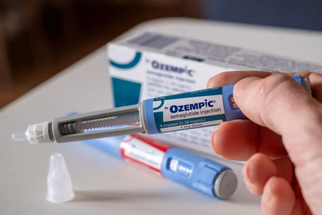 2026-10-16-india-ozempic-brain-protection-stroke-alzheimers-study Hand holding an Ozempic semaglutide injection pen beside its packaging