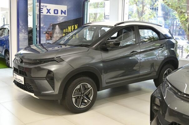 2026-10-16-india-tata-motors-passenger-vehicles-demerger Tata Nexon SUVs parked at a dealership showroom in India