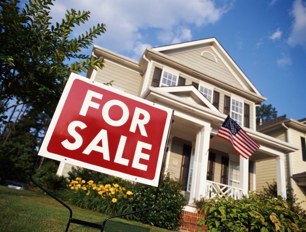 2026-10-16-usa-biz-2 Mortgage rates at 7.4%: for-sale sign outside a US home as borrowing costs hit a near-three-year high