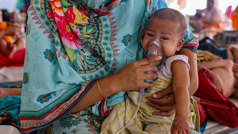 28-wp-top-stories A health worker vaccinates a child in Bangladesh as the Bangladesh measles outbreak spreads across the country.