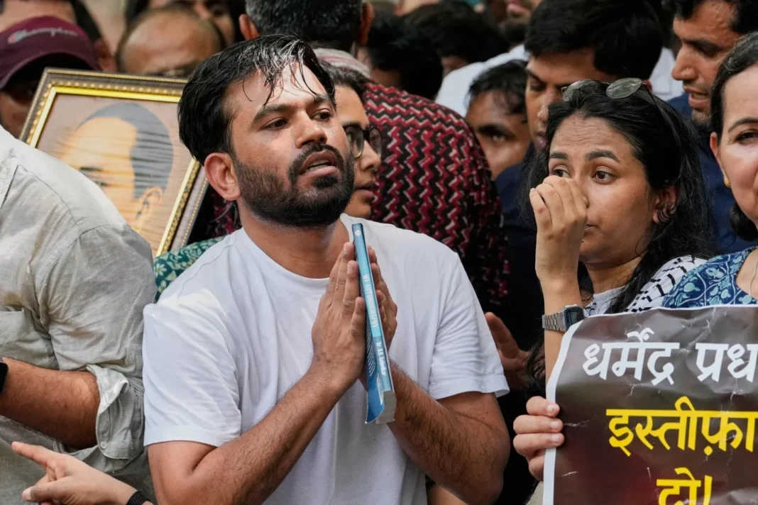 abhijeet-dipke-detention Young protesters at a Delhi demonstration with Hindi placards, part of India's youth-led protest movement.