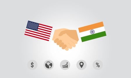 bus-02-us-india-business-ties-trade-tensions US India business ties illustrated by American and Indian flags, reflecting deepening trade, defence and semiconductor partnerships.