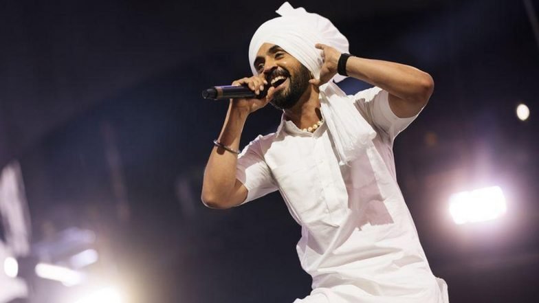 ent_02 Diljit Dosanjh performing on stage during a concert