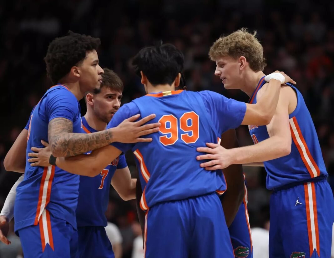 florida-basketball-cbs-sports-preseason-rankings-no1 Florida Gators basketball players in a pregame huddle