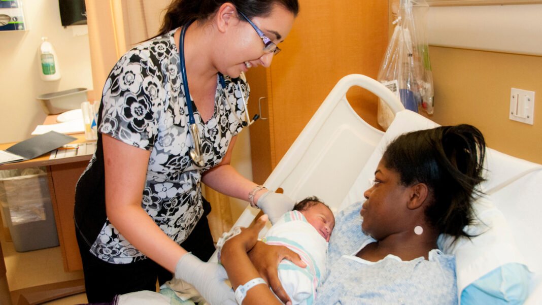 Hepatitis B vaccine: healthcare worker administering vaccine to newborn