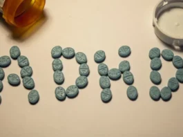 ADHD Medication Mortality Risk Falls 25%, Study Suggests ADHD medication mortality: pills spelling out ADHD next to a prescription bottle