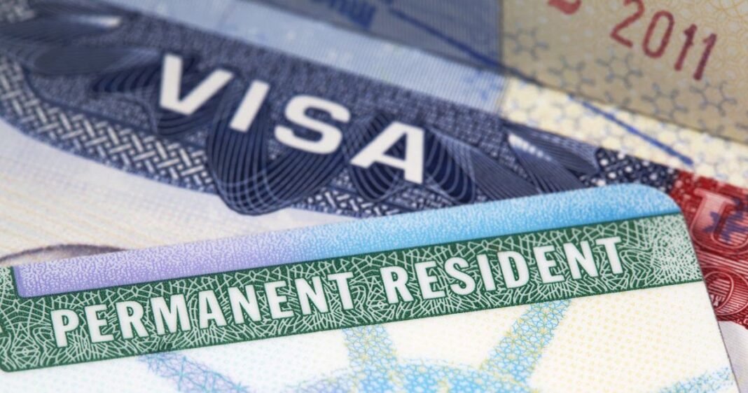 india-2026-10-21-wp-green-card-ban-us-tech-firm US Green Card immigration documents representing the technology company Green Card ban