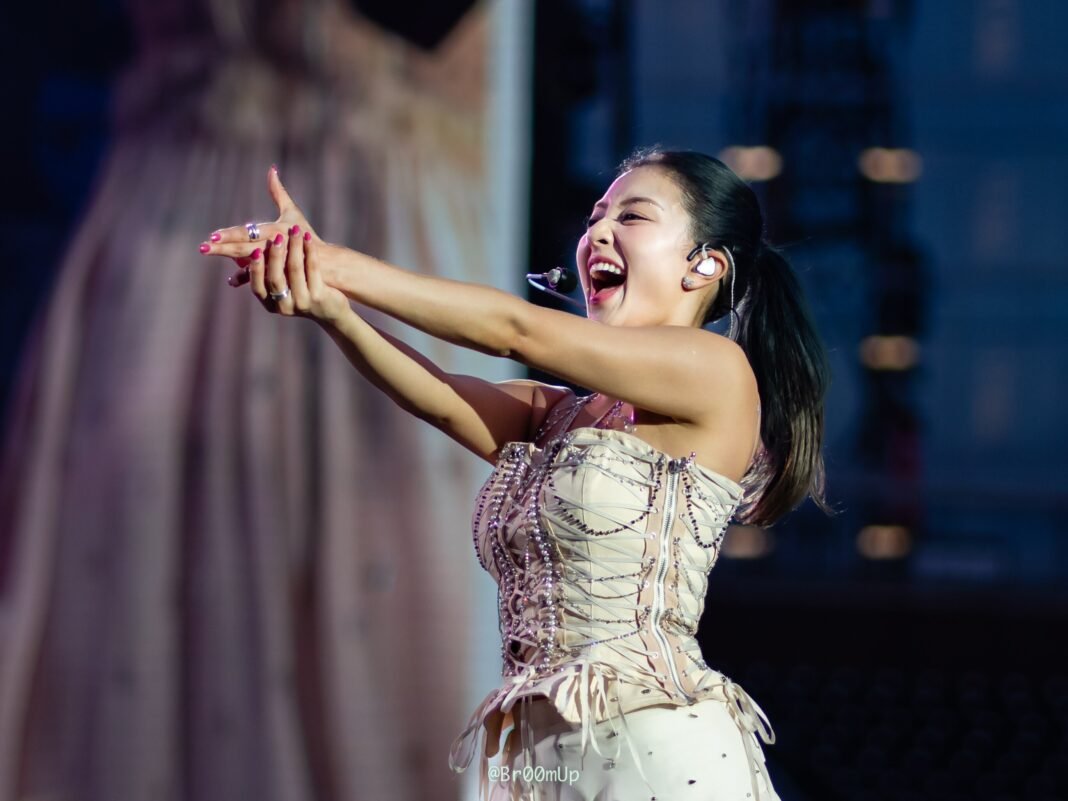 TWICE leader Jihyo performing on stage during a world tour concert