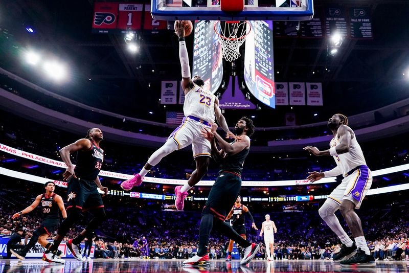 lebron-james-76ers-29-point-comeback-cavaliers LeBron James and Joel Embiid on the court during an NBA game