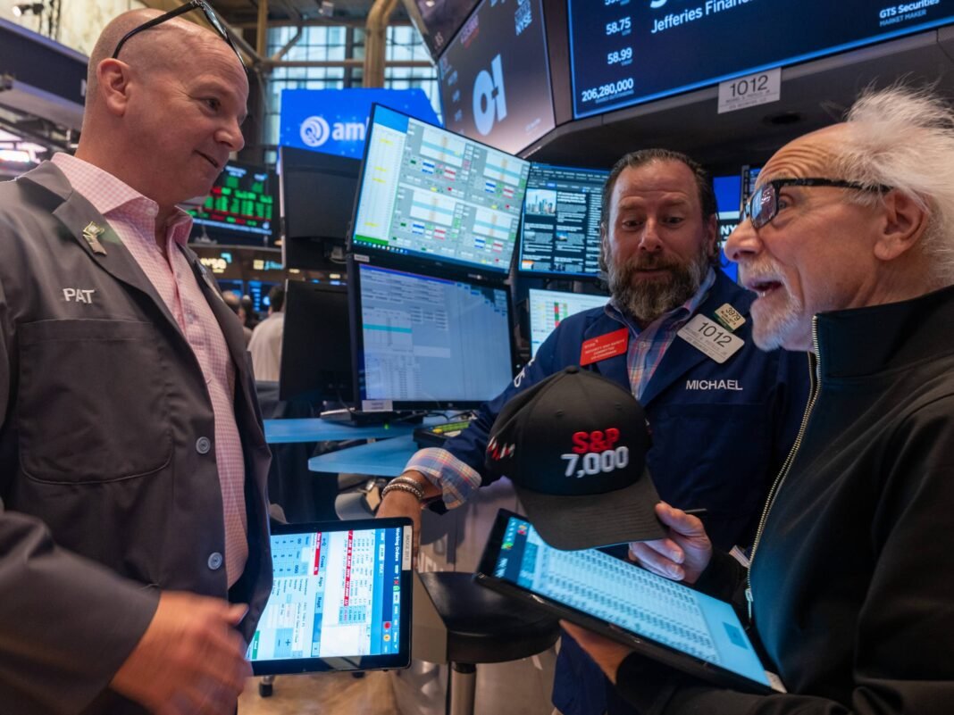 meta-ai-capital-spending-plan-wall-street Traders on the New York Stock Exchange floor watching market screens