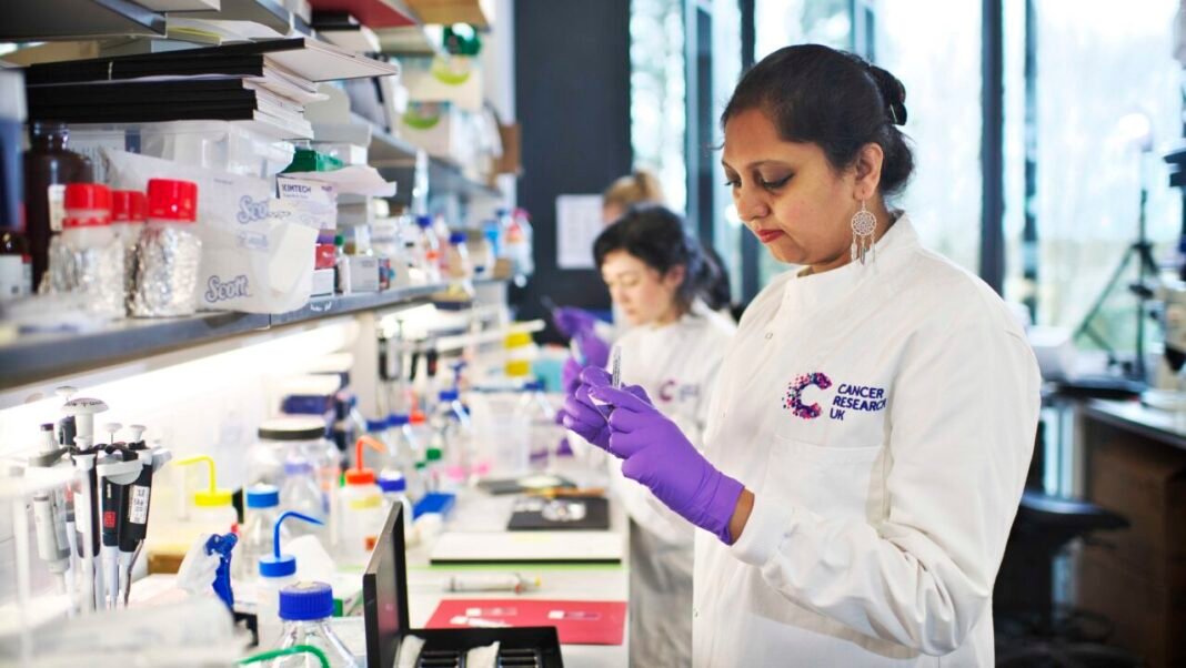 Researchers working in a cancer research laboratory, illustrating RGCB's biopsy-free cervical cancer detection technology