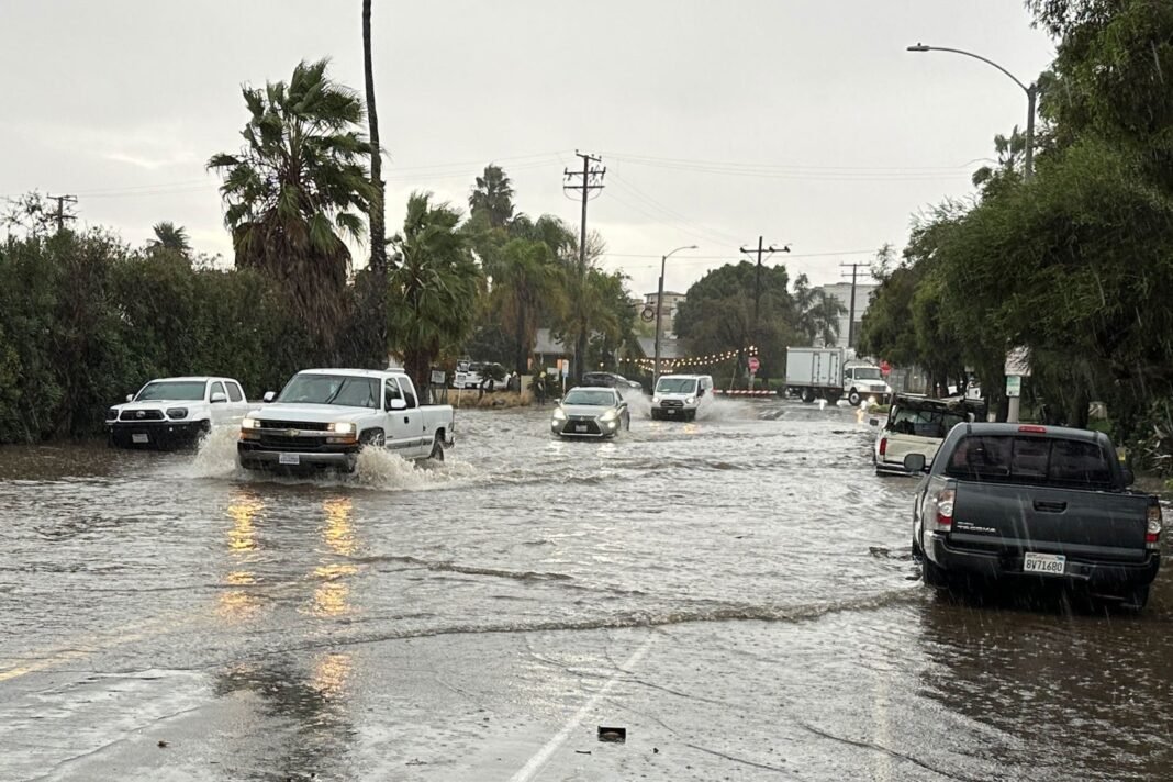 Flooded street in Southern California as storms threaten flooding and debris flows