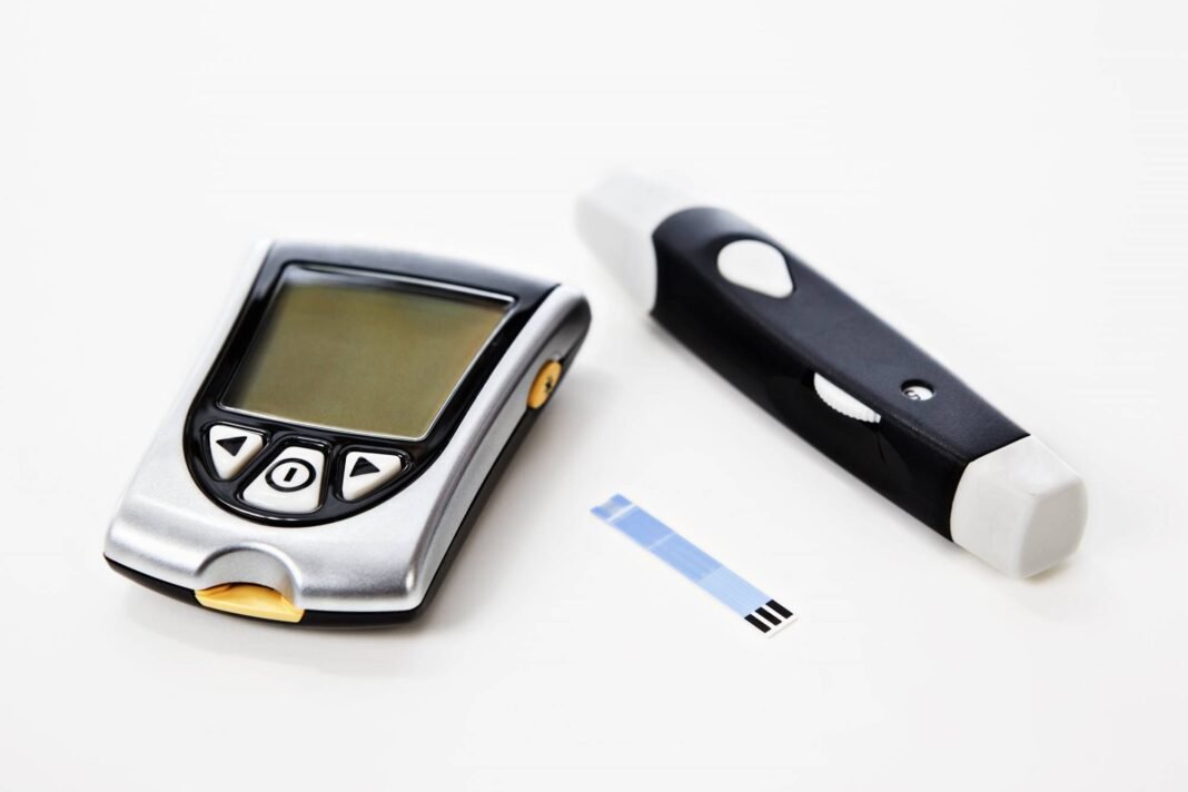 wp-glucose-monitors-type-2-diabetes Continuous glucose monitor device on arm representing glucose monitors for diabetes care