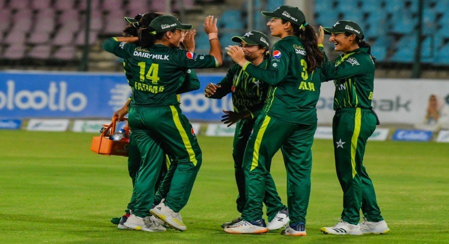 wp_24 women's cricket match, cricket trophy celebration, cricket stadium Pakistan, women cricketers batting